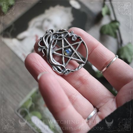 Pentagram pendant surrounded by a tree of life and adorned with a
